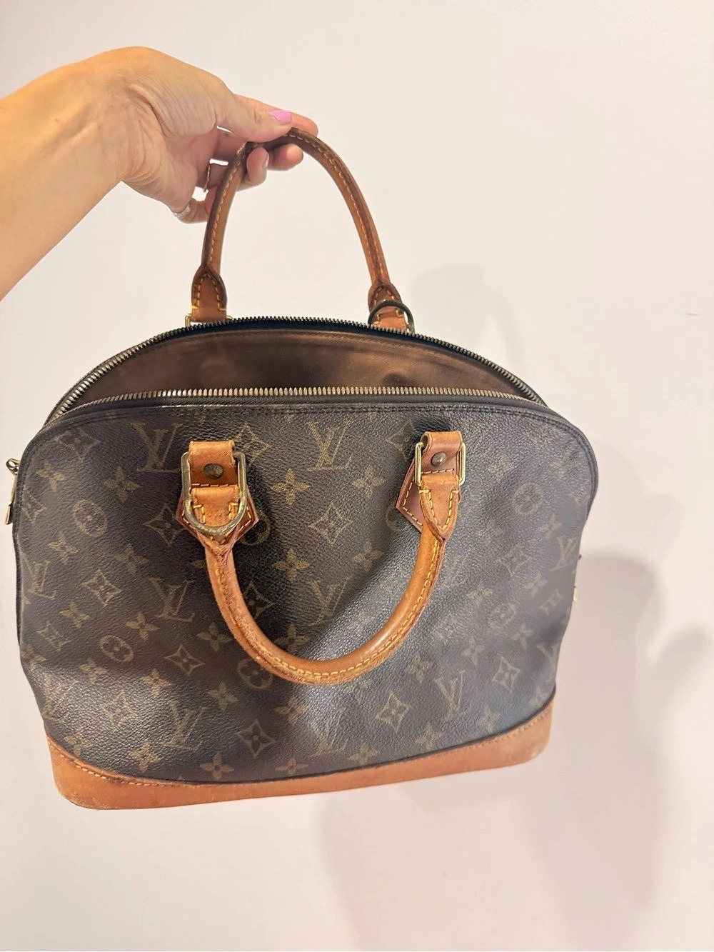 Louis Vuitton Alma PM Monogram Satchel in Brown